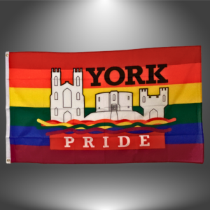 York Pride flag with rainbow stripes and historic buildings, symbolising diversity and inclusion in York.