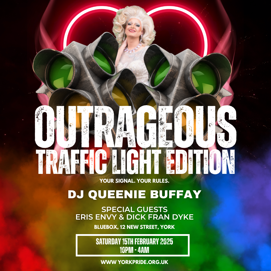 Drag performer at York Pride event Outrageous Traffic Light Edition with colourful smoke background.