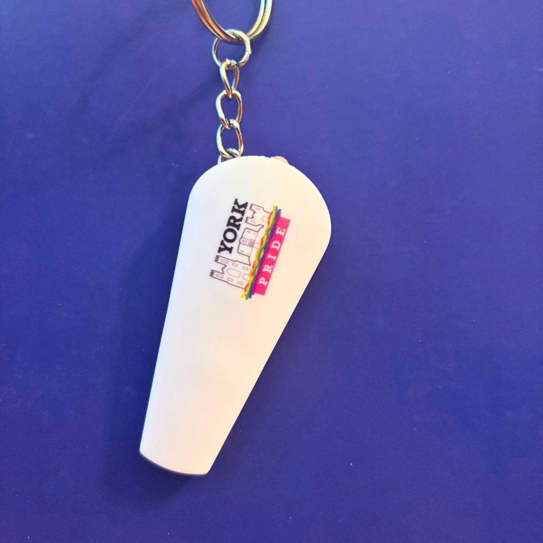 York Pride keychain with rainbow logo on a blue background, representing LGBT+ community support.