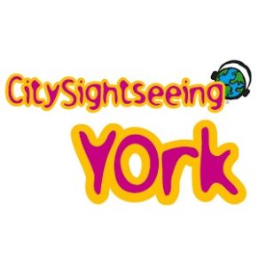 Logo of City Sightseeing York in vibrant pink and yellow text, with a small globe illustration beside the word 'Sightseeing'.